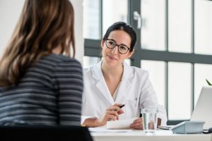 Pharmacist consulting with a patient